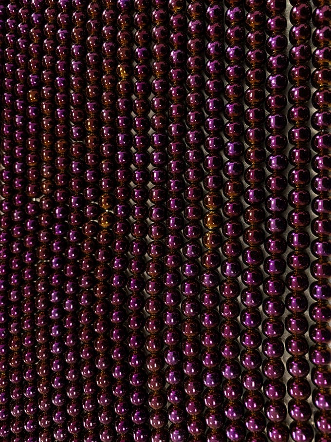 Fil de Perles Rondes Hématite Violet Doré A 6 mm chez Arabesk
