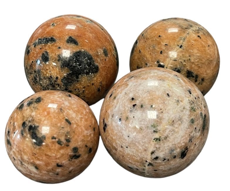 4 Sphères Calcite orange polies 1.852kg chez Arabesk