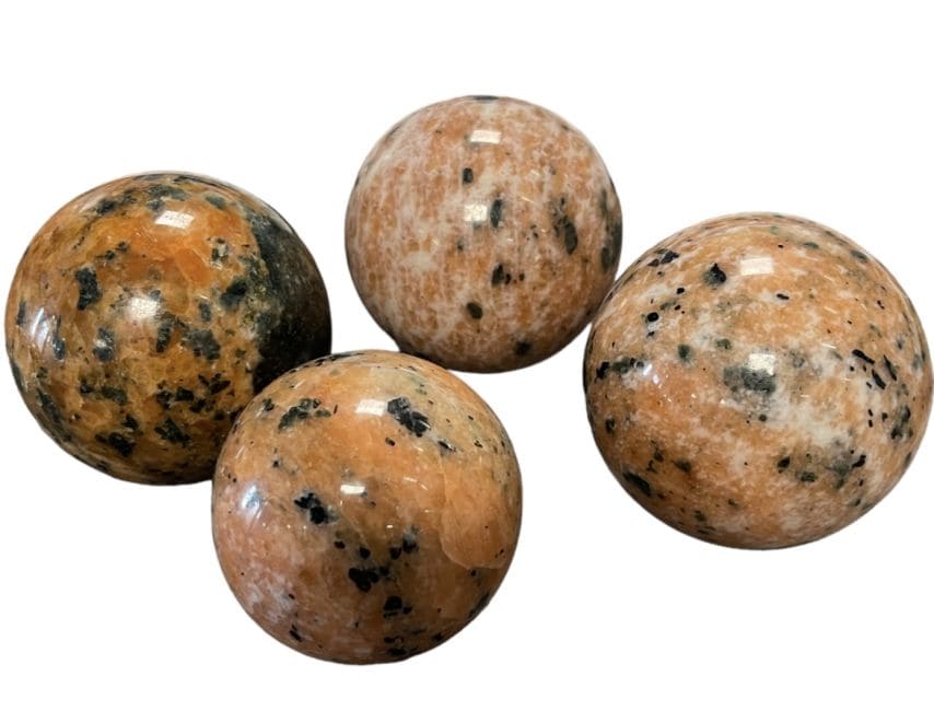 4 Sphères Calcite orange polies 2.129kg chez Arabesk