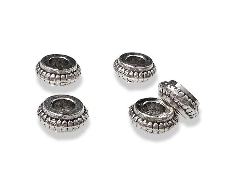 Perles charm's Séparateur Rondelle en Métal Argenté 6mm x100 chez Arabesk