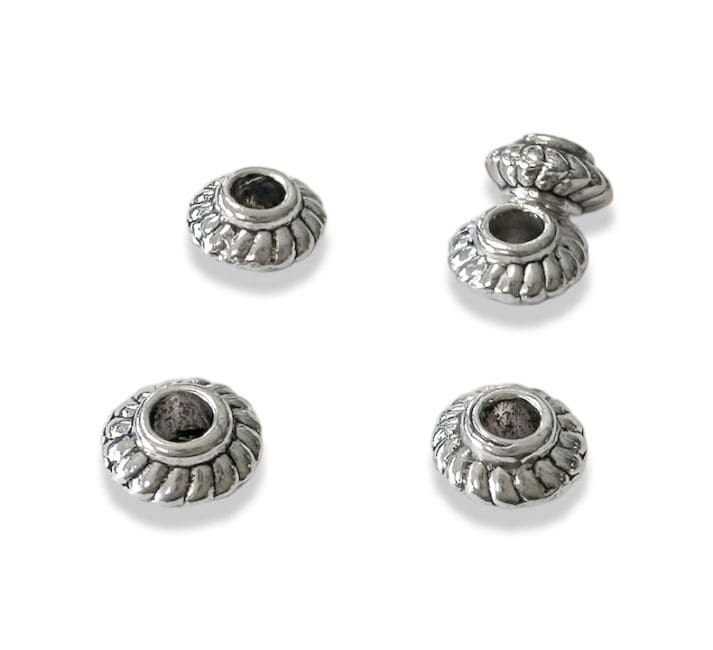 Perles charm's Intercalaire Toupie Argentée 6mm x100 chez Arabesk