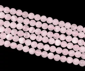 Růžový kalcit AA 6mm na niti 40cm